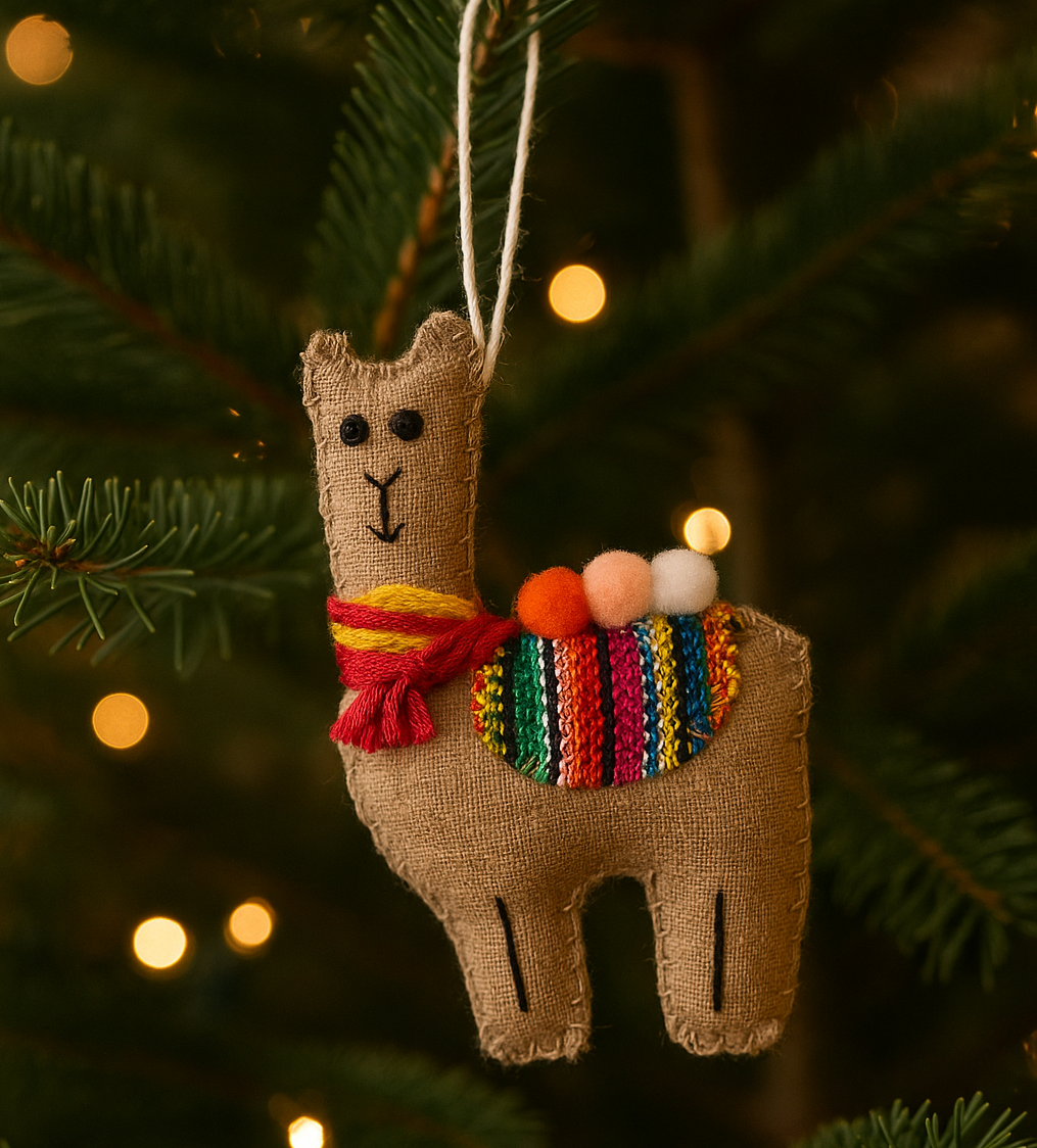 Decorative llama ornament with a colorful scarf hanging on a Christmas tree.